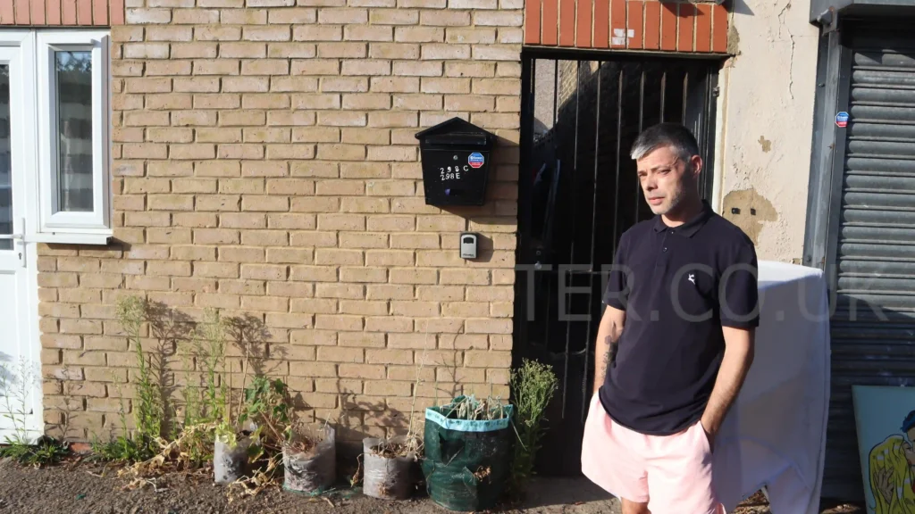 Tony standing outside the property, which is believed to have been converted into flats without planning permission in 2023